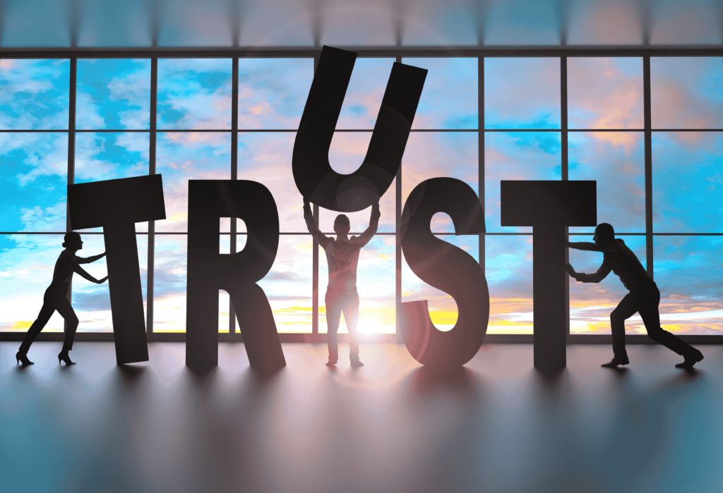 Team of professionals building the word "trust"