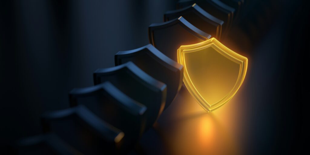A glowing golden shield stands out in a line of dark metallic shields