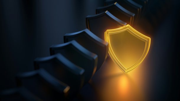 A glowing golden shield stands out in a line of dark metallic shields