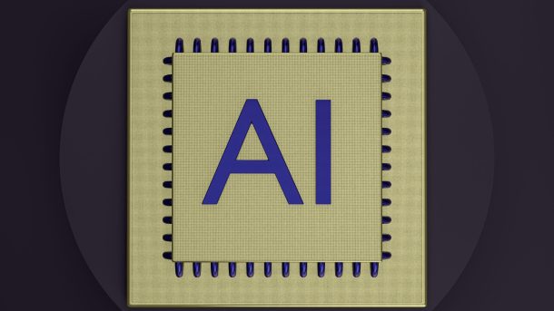 Gold computer chip with the initials “AI.”